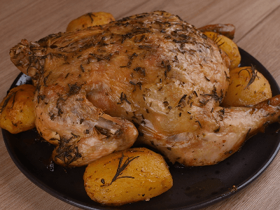 Pollo asado con mantequilla y papas