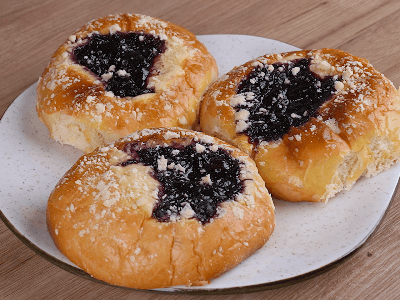 Sweet Buns Filled with Cream and Berry Jam